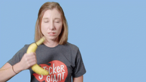 Woman in Sticker Giant Shirt Holding Banana