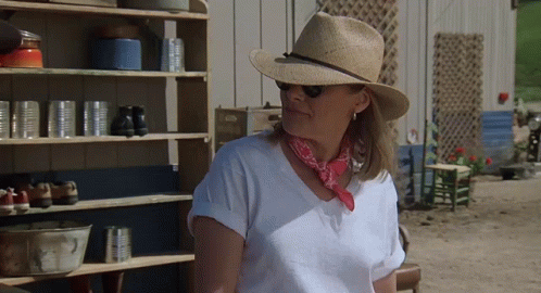 Woman in Straw Hat and Bandana by Shelf