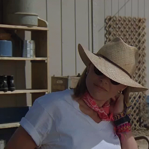 Woman in Straw Hat and Sunglasses