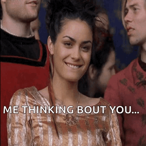 Woman in Striped Dress Smiling Saying Thinking Bout You