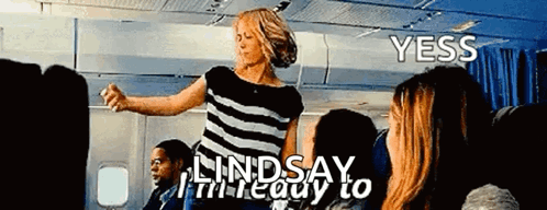 Woman In Striped Shirt Dancing On Airplane GIF