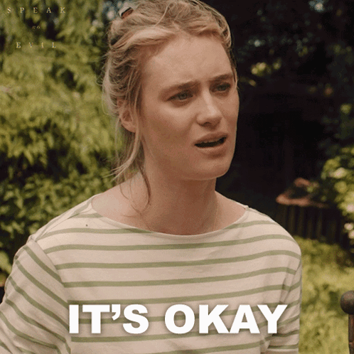 Woman in Striped Shirt Saying It's Okay