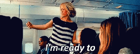 Woman In Striped Shirt Says I'm Ready To On An Airplane GIF
