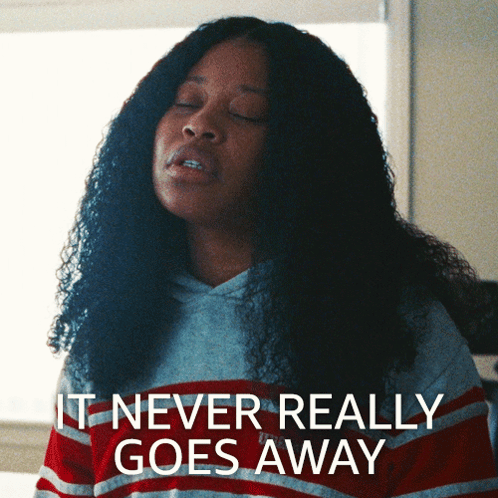 Woman In Striped Shirt Says It Never Really Goes Away GIF