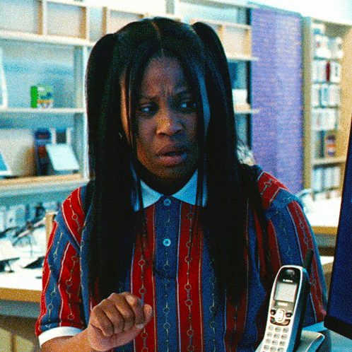 Woman In Striped Shirt Talking On Siemens Telephone GIF