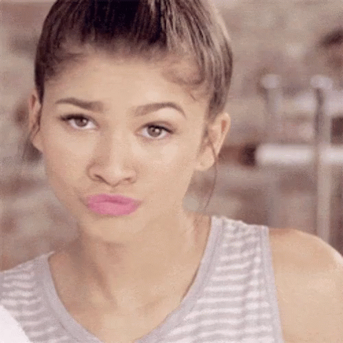 Woman In Striped Tank Top Making Face GIF