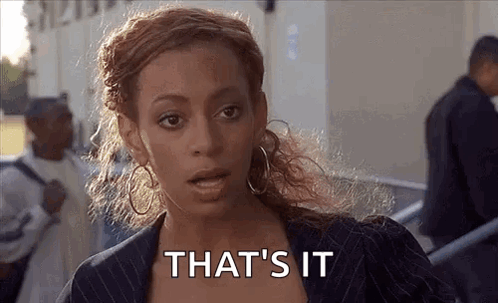 Woman In Suit And Hoop Earrings Saying That's It GIF