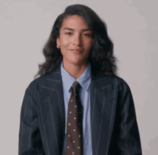 Woman In Suit Giving Middle Finger GIF