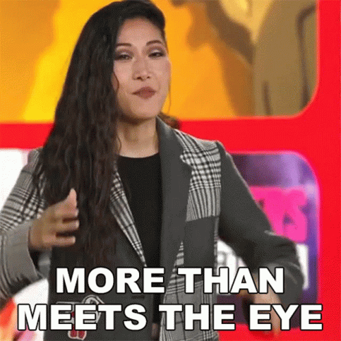 Woman in Suit in Front of Red Sign More Than Meets the Eye