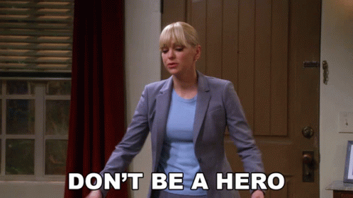 Woman in Suit Saying Don't Be a Hero