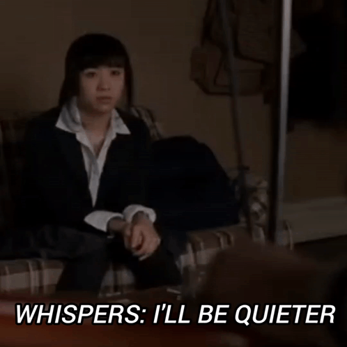 Woman in Suit Saying I'll Be Quieter