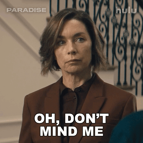 Woman In Suit Saying Oh Don't Mind Me In Front Of Staircase GIF