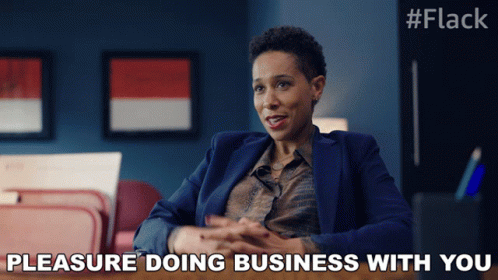 Woman in Suit Saying Pleasure Doing Business with You