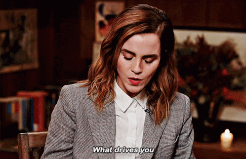Woman in Suit Saying What Drives You