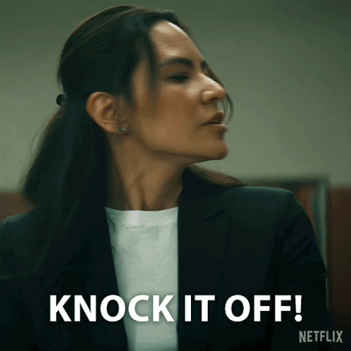 Woman In Suit Says Knock It Off Netflix Ad GIF