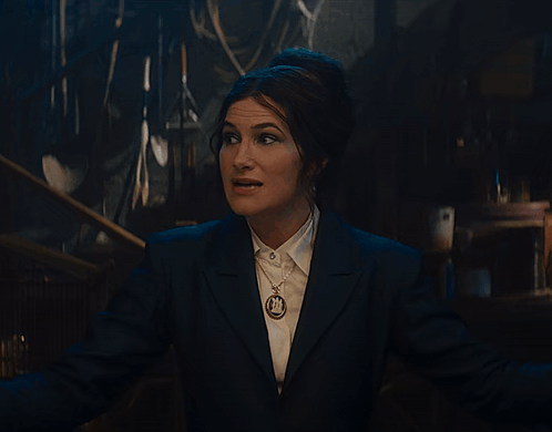 Woman in Suit Singing Down Down Down