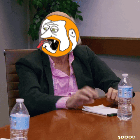 Woman in Suit Sitting at Table with Water