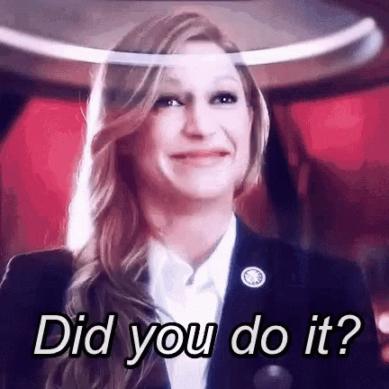 Woman in Suit Smiling Asking Did You Do It