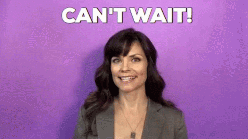 Woman In Suit Smiling Saying Cant Wait GIF
