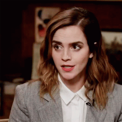 Woman in Suit Talking on Microphone with Funny Face