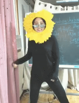 Woman in Sunflower Costume With Shabang Shaping Chalkboard