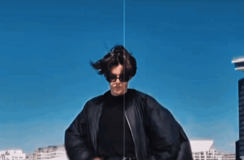Woman In Sunglasses And Black Jacket Dancing GIF