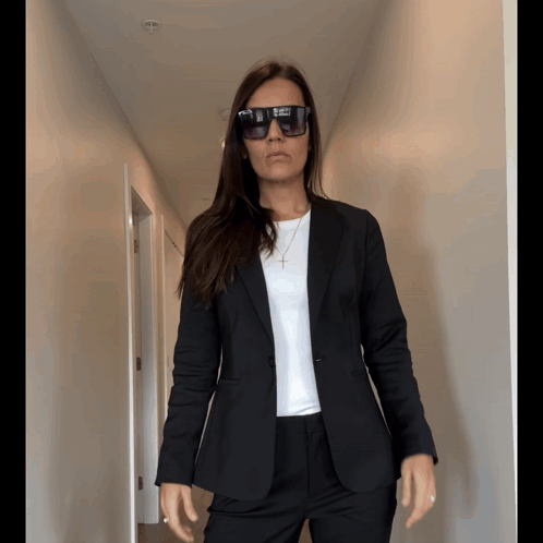 Woman In Sunglasses And Black Suit GIF