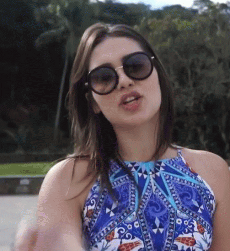 Woman in Sunglasses and Blue Halter Top