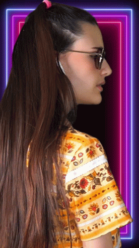 Woman in Sunglasses and Floral Shirt Looking Sideways
