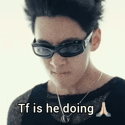 Woman in Sunglasses and Necklace Saying TF Is He Doing