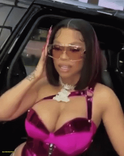 Woman In Sunglasses And Pink Bra Sitting In Car GIF