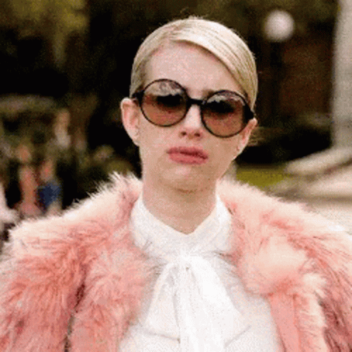 Woman in Sunglasses and Pink Fur Coat