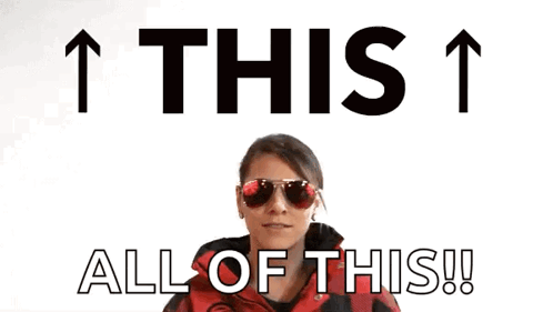Woman In Sunglasses And Red Jacket Pointing Up Saying This 1 All Of This GIF