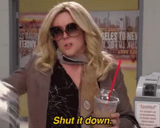 Woman in Sunglasses and Scarf Saying Shut It Down