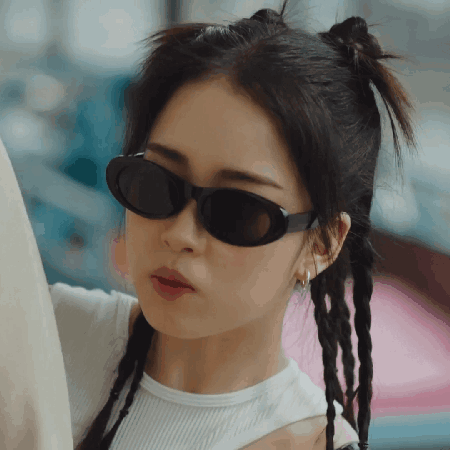 Woman in Sunglasses and White Shirt
