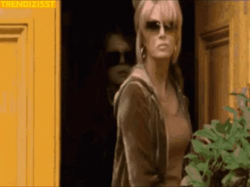 Woman in Sunglasses at Yellow Door