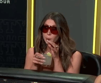 Woman in Sunglasses Drinking With Straw
