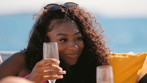 Woman in Sunglasses Holding Glass of Wine