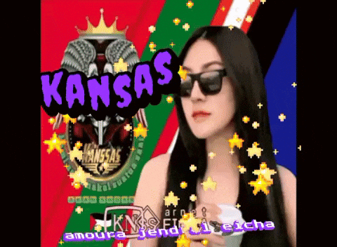 Woman in Sunglasses in Front of Kansas Banner