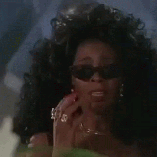 Woman in Sunglasses Ring Talking on Phone