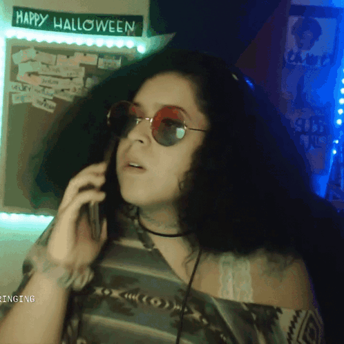 Woman In Sunglasses Talking On Phone GIF
