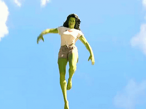 Woman in Superhero Costume Jumping with Arms Outstretched