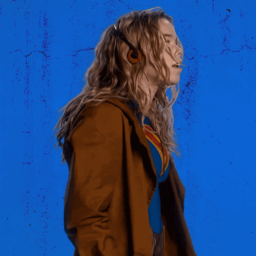 Woman In Superman Costume Blue Wall GIF