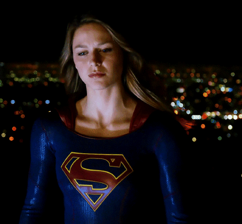 Woman In Superman Costume In City At Night GIF
