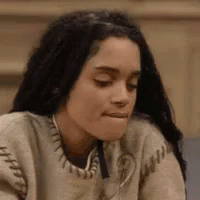 Woman In Sweater Making Face GIF