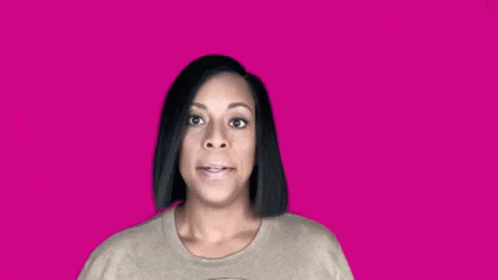 Woman in Sweater Making Funny Face on Pink