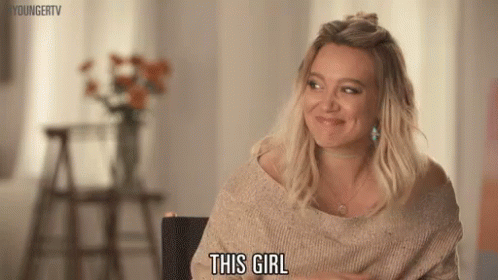 Woman In Sweater Smiling GIF