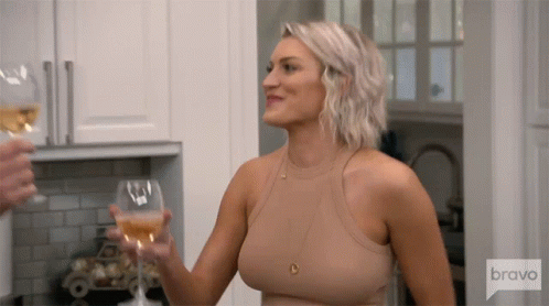 Woman in Tan Tank Top Holding Wine Glass