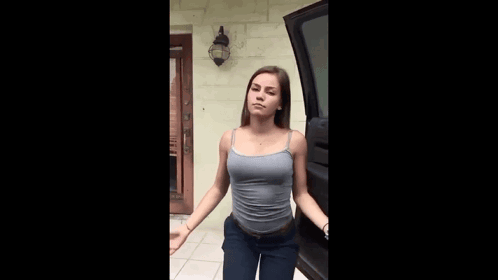 Woman in Tank Top and Jeans
