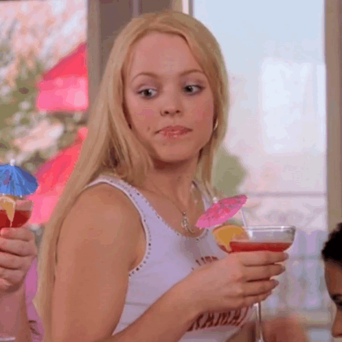 Woman in Tank Top With Kama Holding Martini